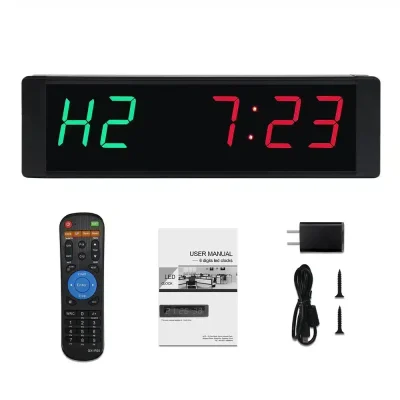 Gym Timer Mini med grøn og rød LED-display, fjernbetjening, brugervejledning, oplader, kabel og skruer.