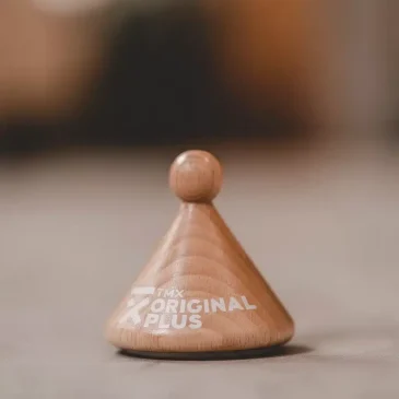Træspids med teksten "TMX Original Plus".